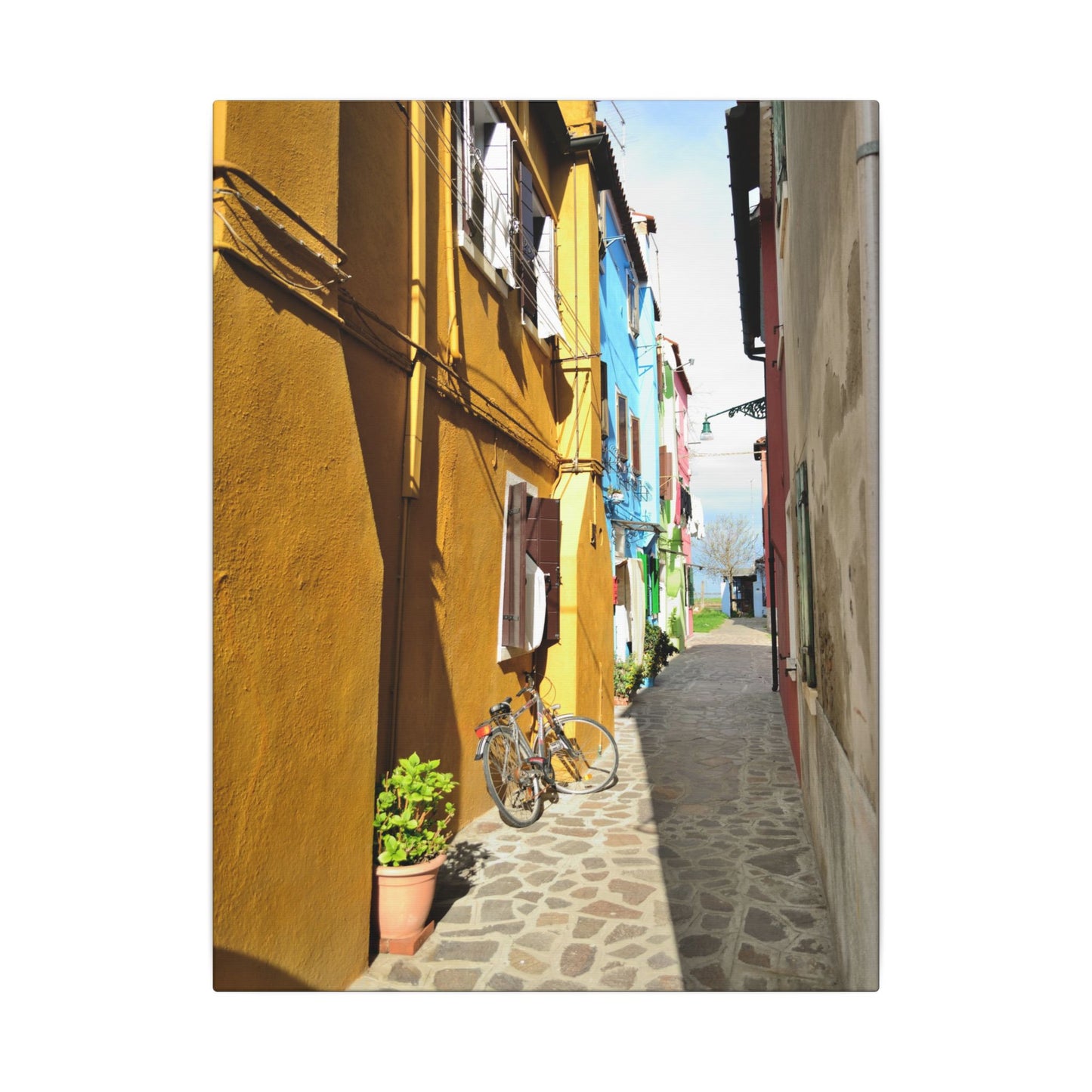 Mulano Street Scene Matte Canvas Print — Yellow Houses & Hanging Clothes, Stretched Wall Art