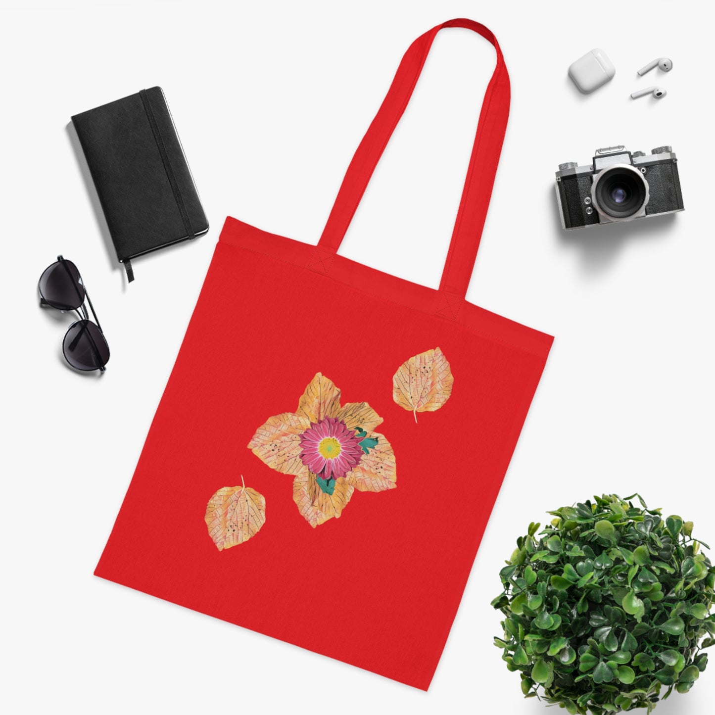 fallen-leaves-autumn-design-with-red-flower - front view