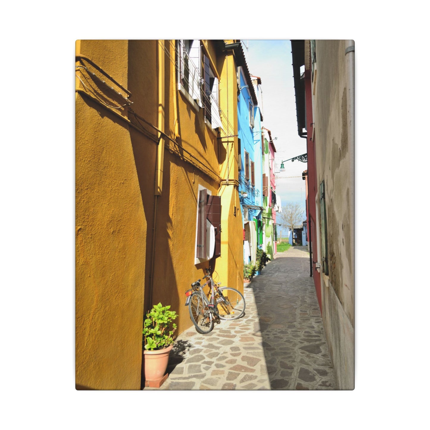 Mulano Street Scene Matte Canvas Print — Yellow Houses & Hanging Clothes, Stretched Wall Art