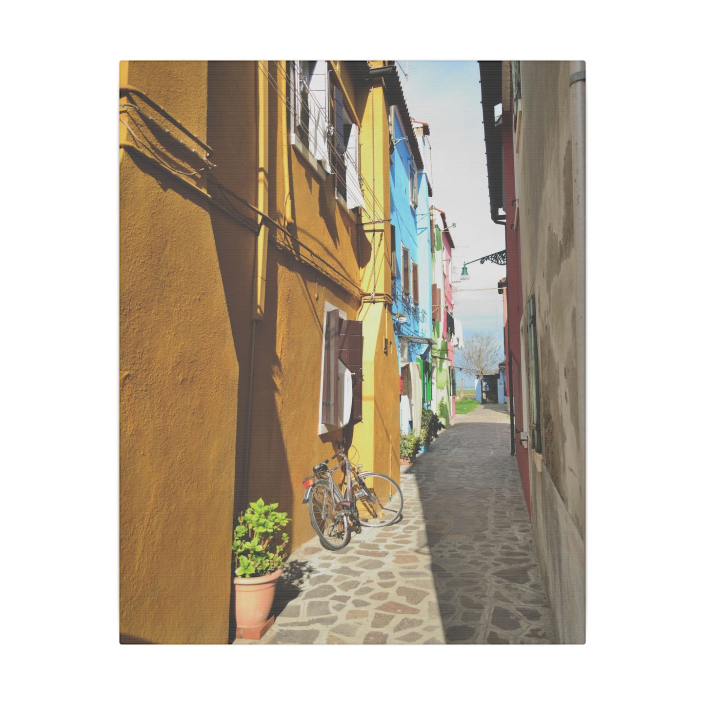 Mulano Street Scene Matte Canvas Print — Yellow Houses & Hanging Clothes, Stretched Wall Art
