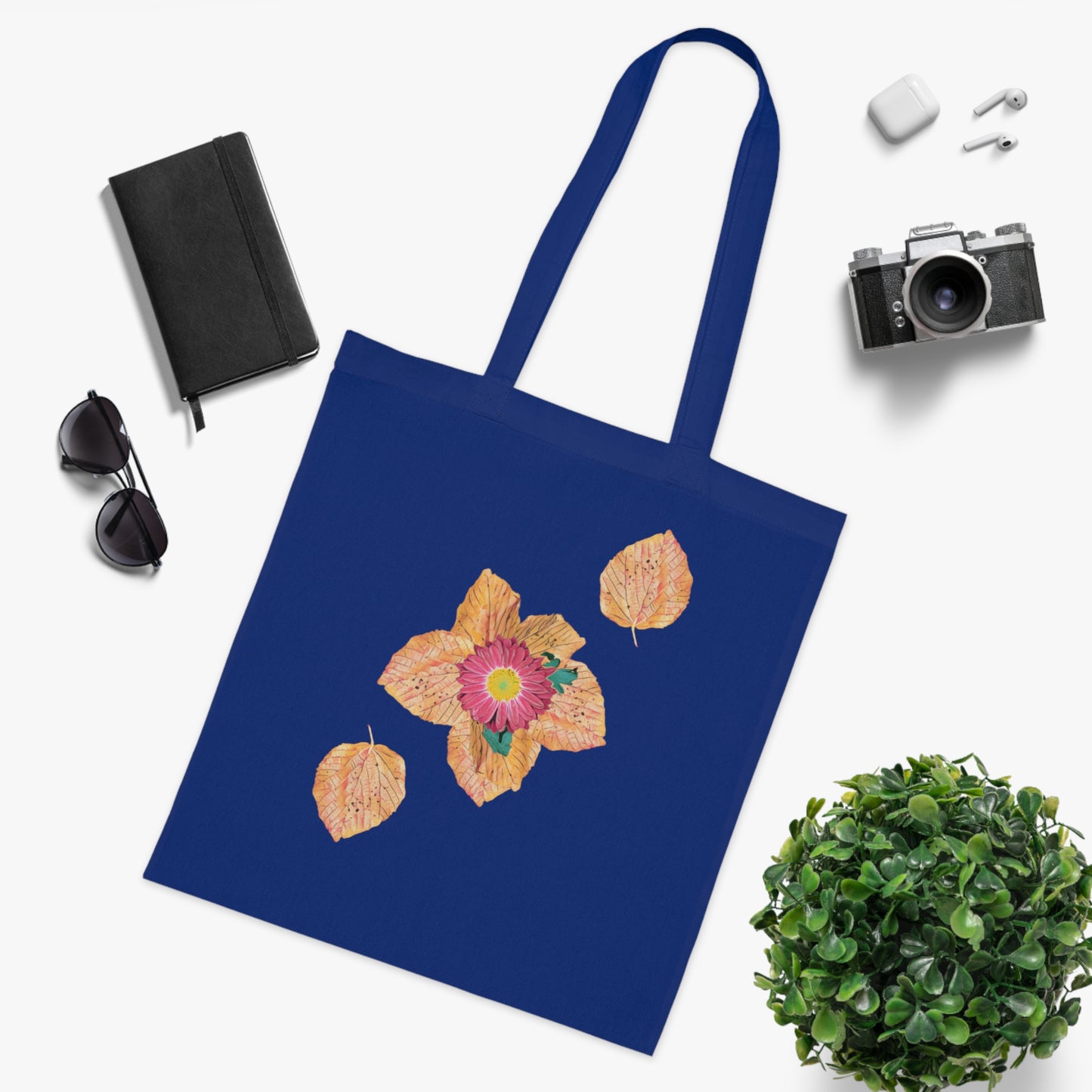 fallen-leaves-autumn-design-with-red-flower - front view