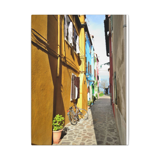 Mulano Street Scene Matte Canvas Print — Yellow Houses & Hanging Clothes, Stretched Wall Art